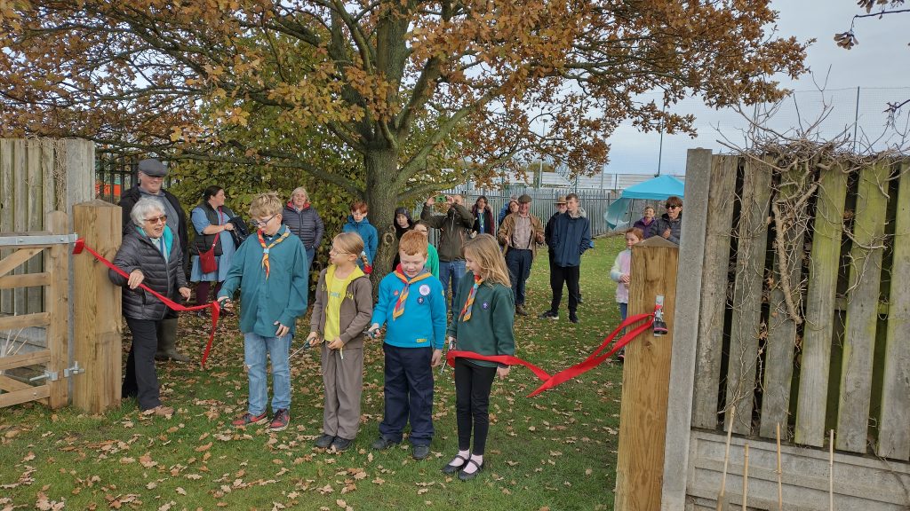 Scouts, Cubs, Beavers and Brownies cutting ribbon